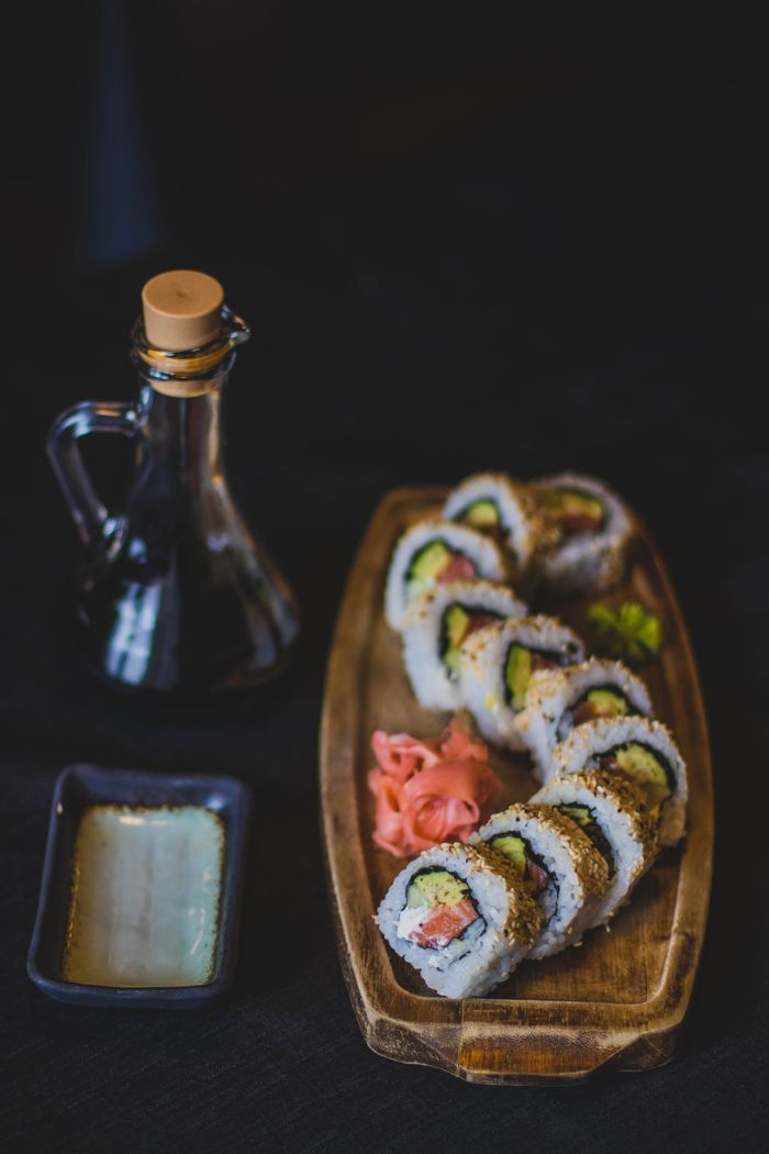 ours-journey A mouthwatering sushi platter with soy sauce, perfect for a traditional Japanese meal.
